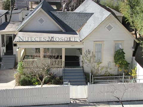 Front exterior of Nueces Mosque in Austin, viewed from the street.