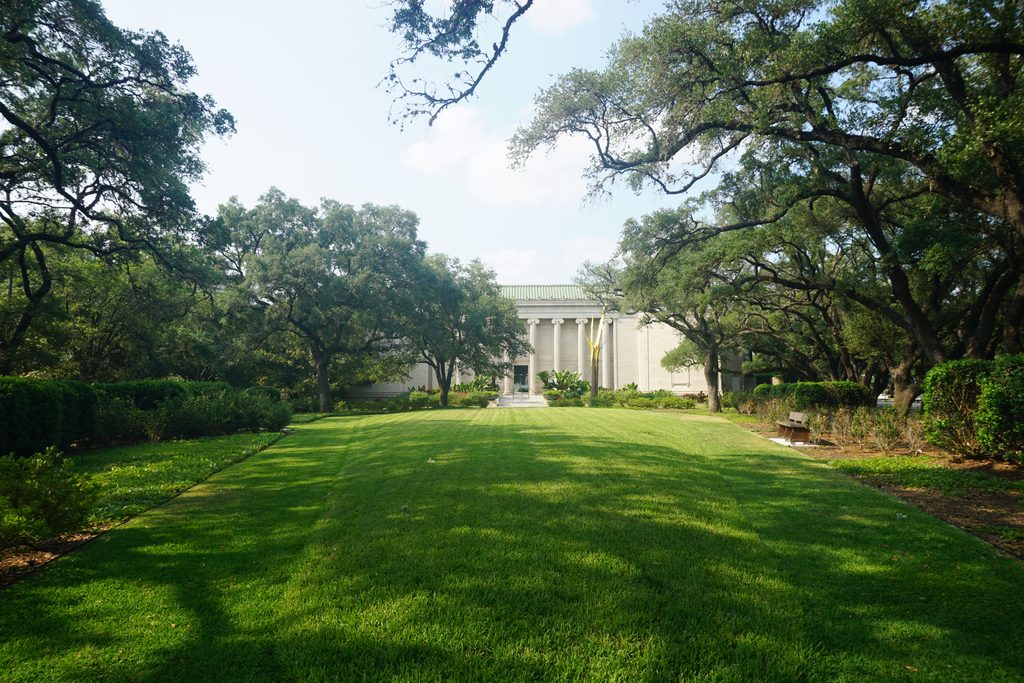 Exterior of the Caroline Wiess Law Building at the Museum of Fine Arts, Houston, with its lawn in front.